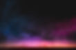 empty-wooden-table-with-colorful-smoke-float-up-dark-background.jpg