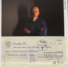 A photo of the music artist Peter Gabriel sits above a signed cheque of his from Coutts Bank
