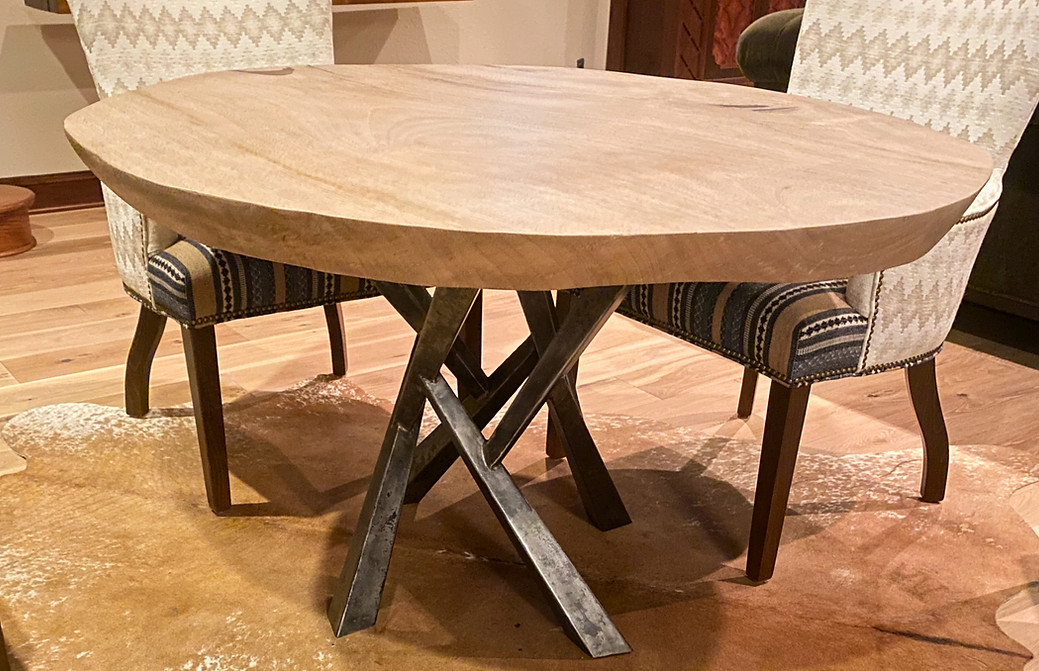 custom table with metal base and live edge table top.