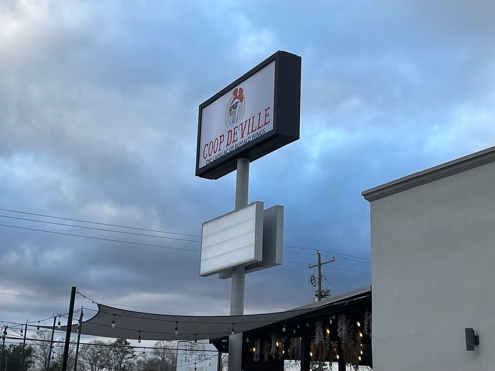 Outside sign of Coop Deville