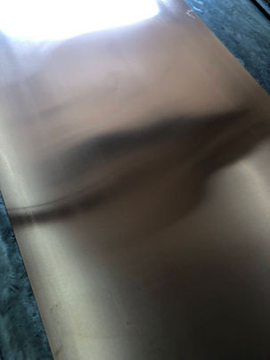 Abstract shadow on a reflective surface.