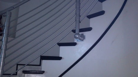 Curved staircase with a sleek, modern design.