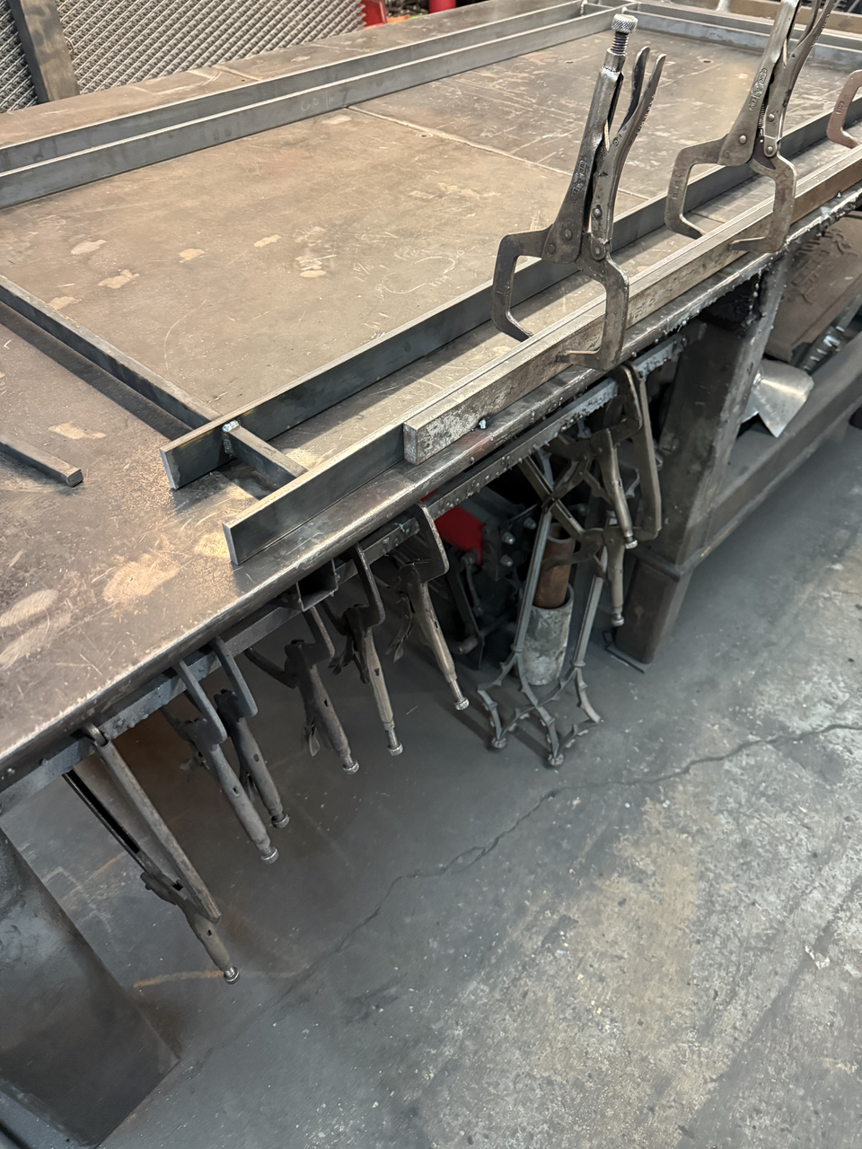 Workshop with metal tools and clamps.