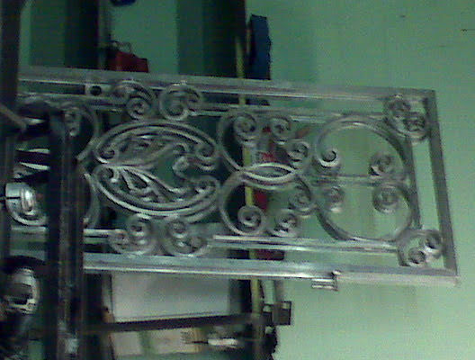 Ornate metalwork with intricate swirling patterns.