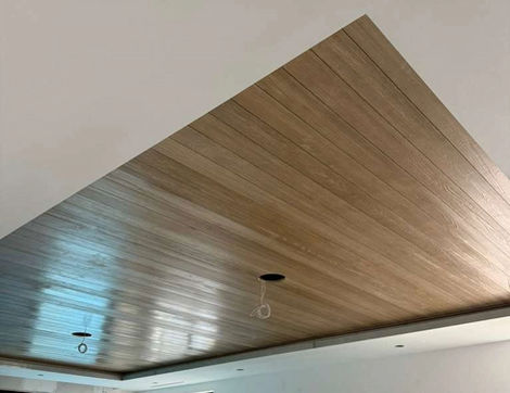 Diagonal wooden ceiling with spotlights