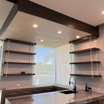 Contemporary kitchen with floating shelves and large window