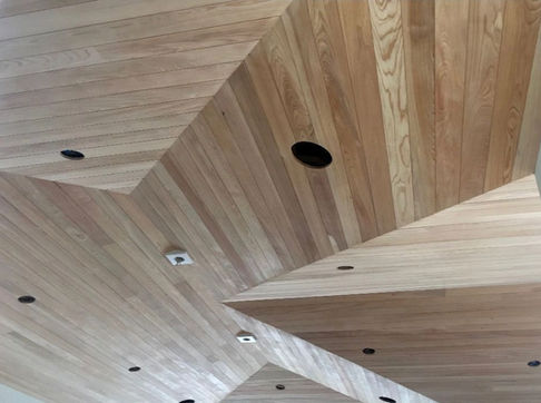 Geometric wooden ceiling with recessed lighting