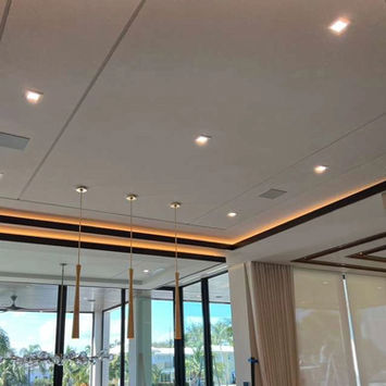 Modern ceiling with recessed lighting and large windows