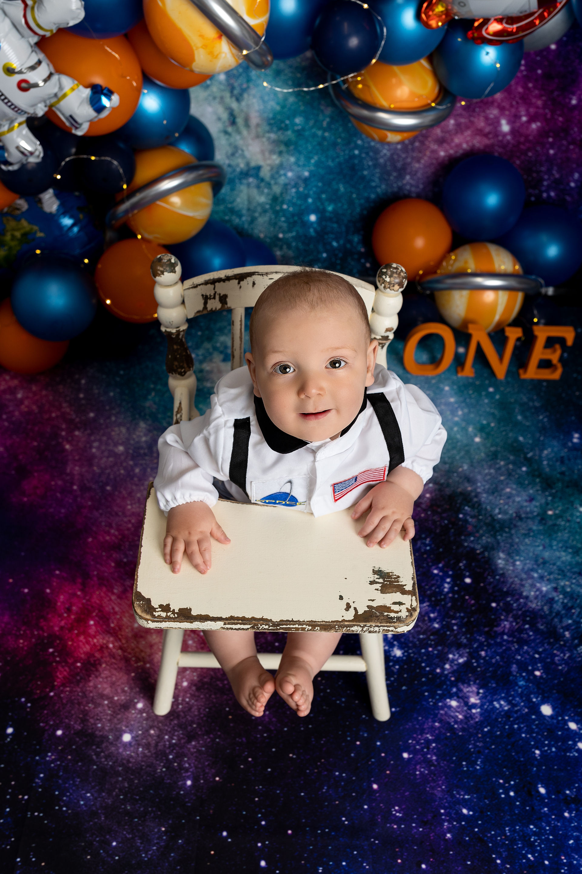 Baby boy NASA birthday outfit and galaxy themed backdrop