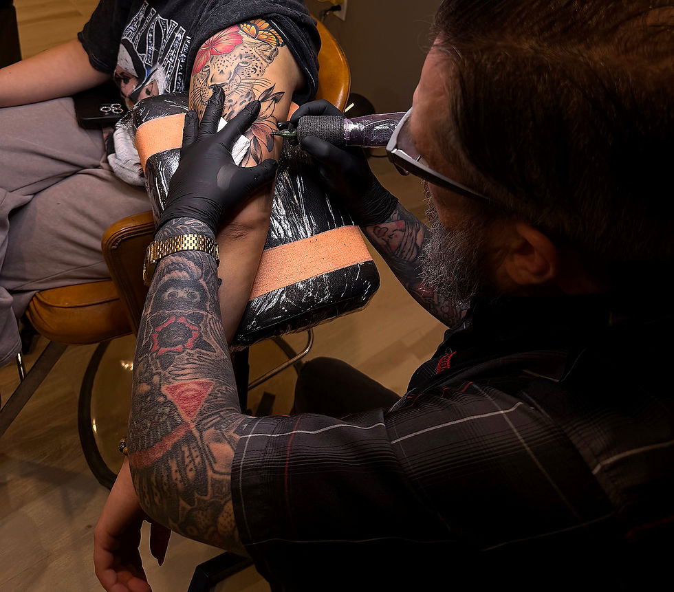 Raymond Parker working on a custom tattoo at Iron Rose Tattoo in Lee's Summit, Missouri