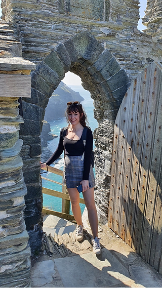 Archaeologist standing near coastal site