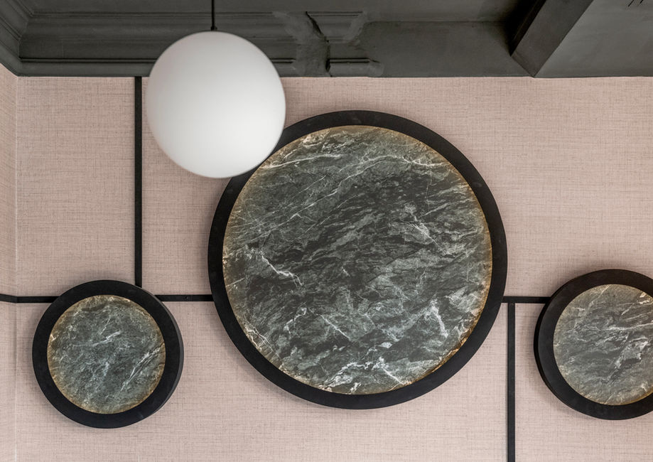 Luxury restaurant interior design in Frankfurt with warm lighting, bespoke furniture, and refined material palette