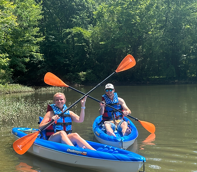 Two people kayaking on Mountain Island Lake in Charlotte, North Carolina