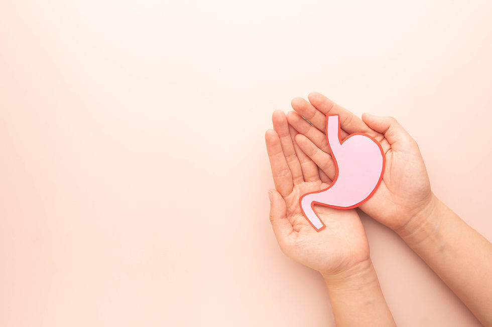 Holistic Nutritionist's healing hands holding acid reflux stomach caringly.