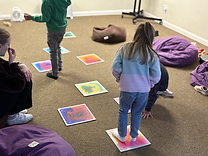 Liquid squares on the floor with children stepping on them