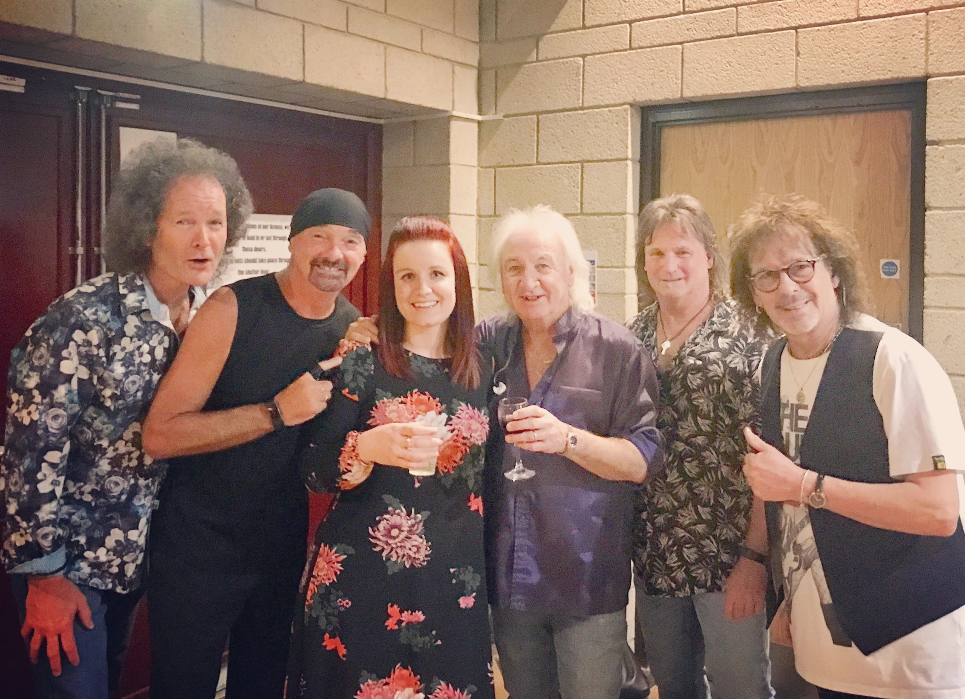 Charlie in the centre, surrounded by rock band Smokie backstage at the Barbican Theatre in York.