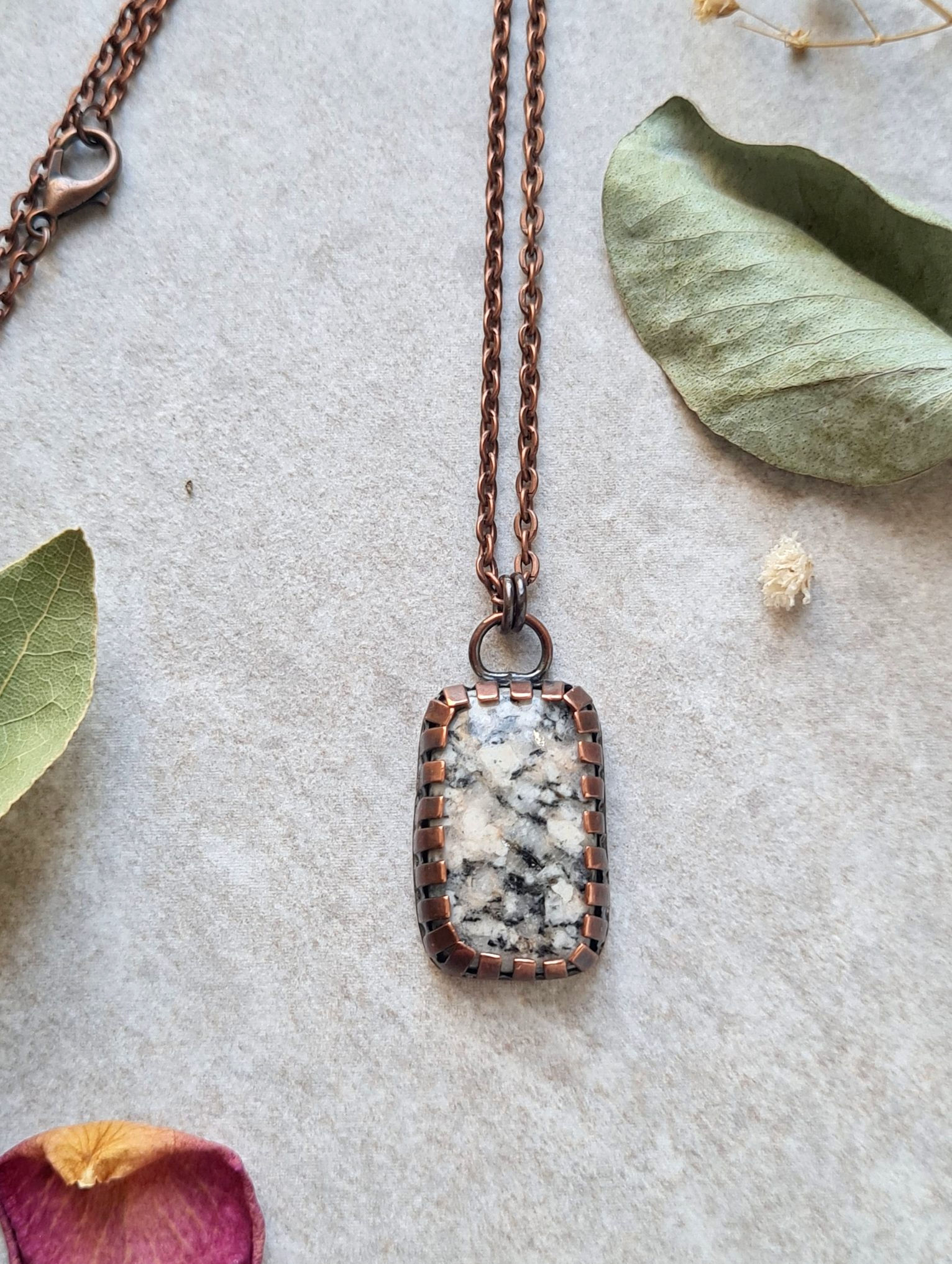 Edinburgh Cobblestone Pendant — hand‑cut salvaged stone set in copper, shown on a soft neutral background.