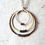 Thumbnail: Copper, brass and silver hoop necklace with copper coils.