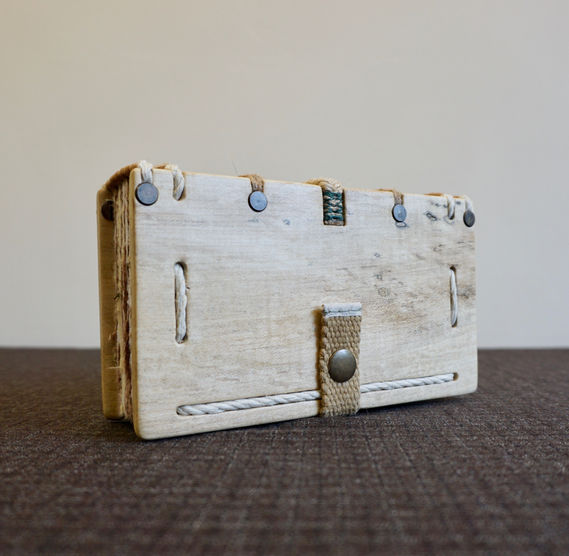 A handmade spalted sycamore notebook and hemp webbing book clasp.
