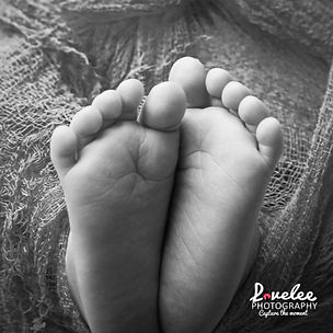 Capturing those tiny newborn toes during the perfect photo window — 5 to 15 days old.