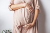 pregnant-woman-s-belly-closeup-hands-hugging-belly-concept-maternal-health.png