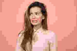 woman bitting lip