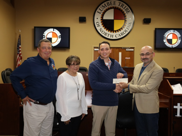 Thank you to Joshua Malcolm, CEO of Lumbee Holdings, Inc. who presented a $25,000 check at the Presenting Sponsor Level to Lumbee Gala Committee Chairs Speaker McNeill and Treasurer Hunt