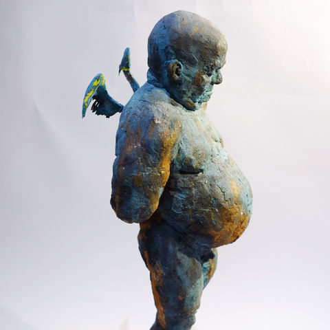 a statue of a man with wings on his back