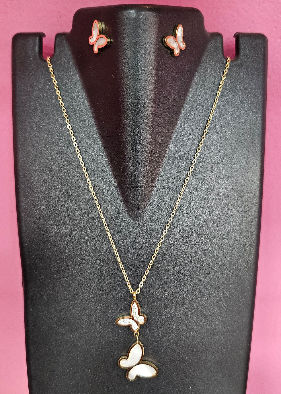Gold butterfly pendant necklace on display, elegant jewelry, JeJo Stores.
