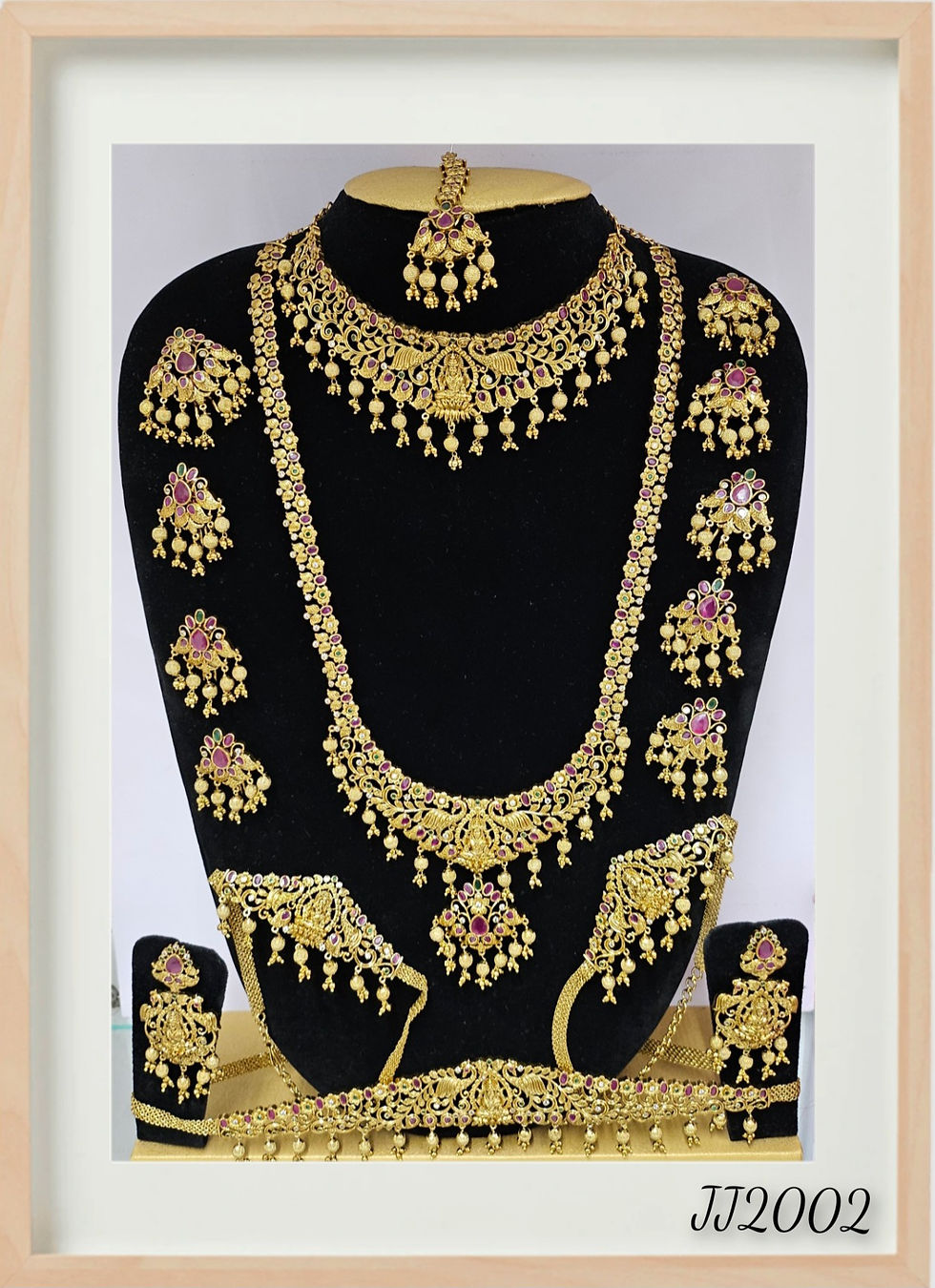 Golden bridal jewelry set on black mannequin Bridal Jewellery AD Silver Polish