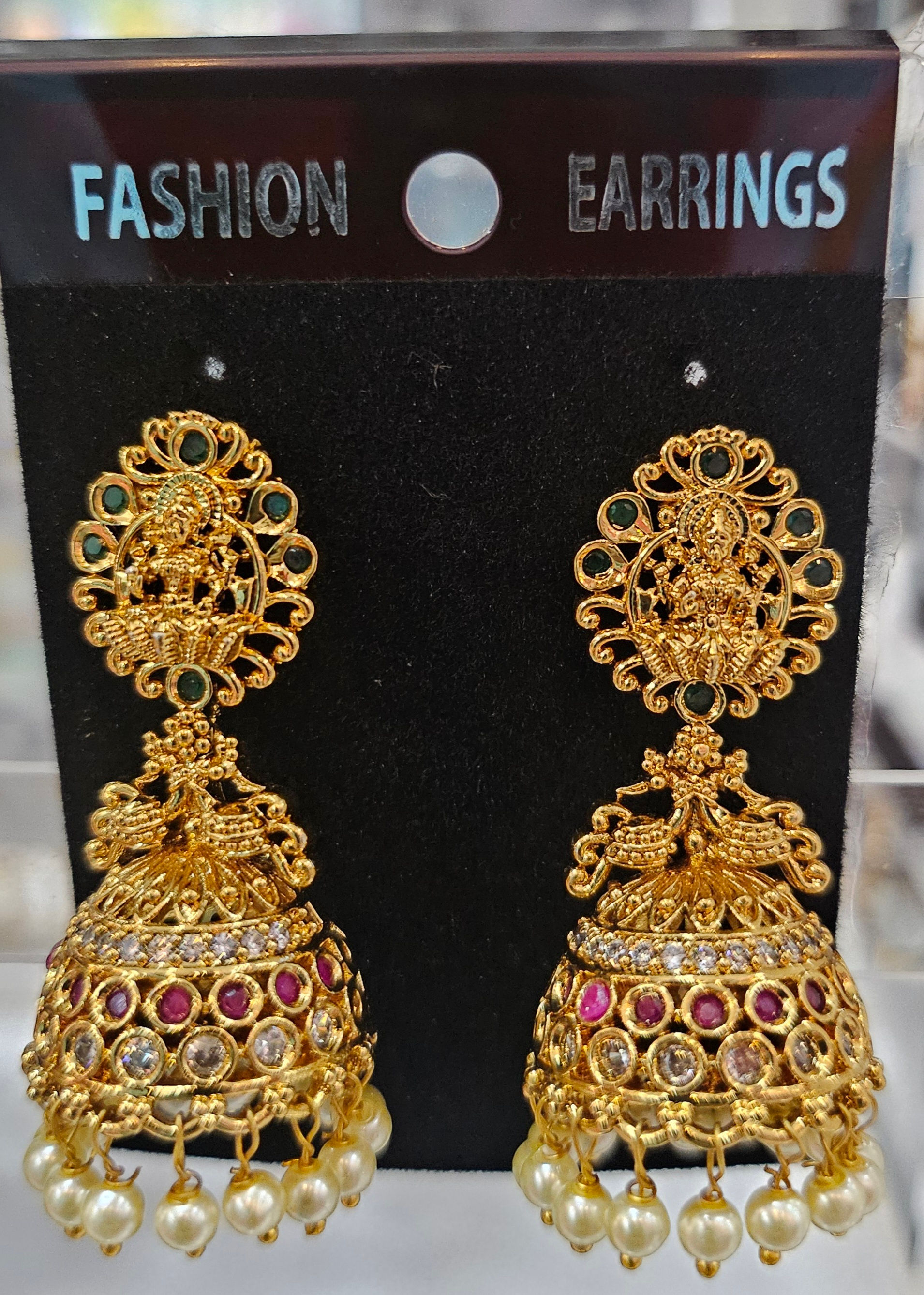 Golden earrings Fashion Earrings display with detailed design and gems, JeJo Stores