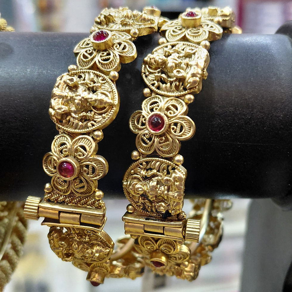 Intricate gold plated Kada bangles with ruby accents