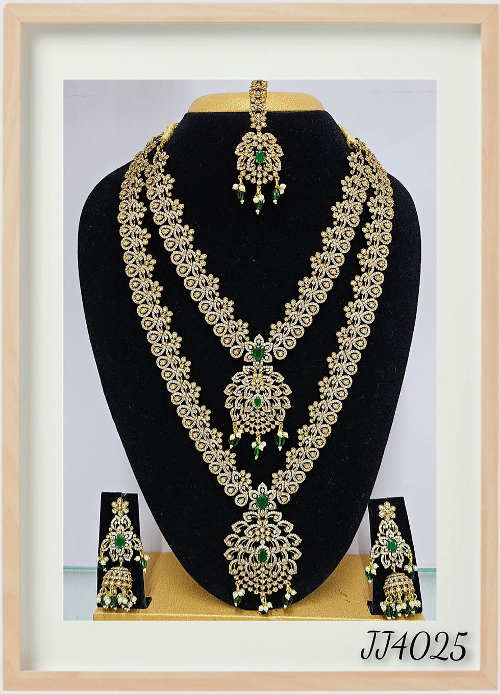 Elegant bridal jewelry set, Bridal Jewellery North Indian Style, with emerald accents and JeJo Stores.