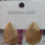 Two golden, teardrop-shaped "Stainless steel" earrings with ribbed texture.