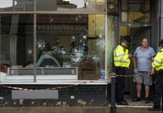 The aftermath of two nights of violent clashes between protesters & police caused tens of thousands of pounds worth of damage to local businesses
