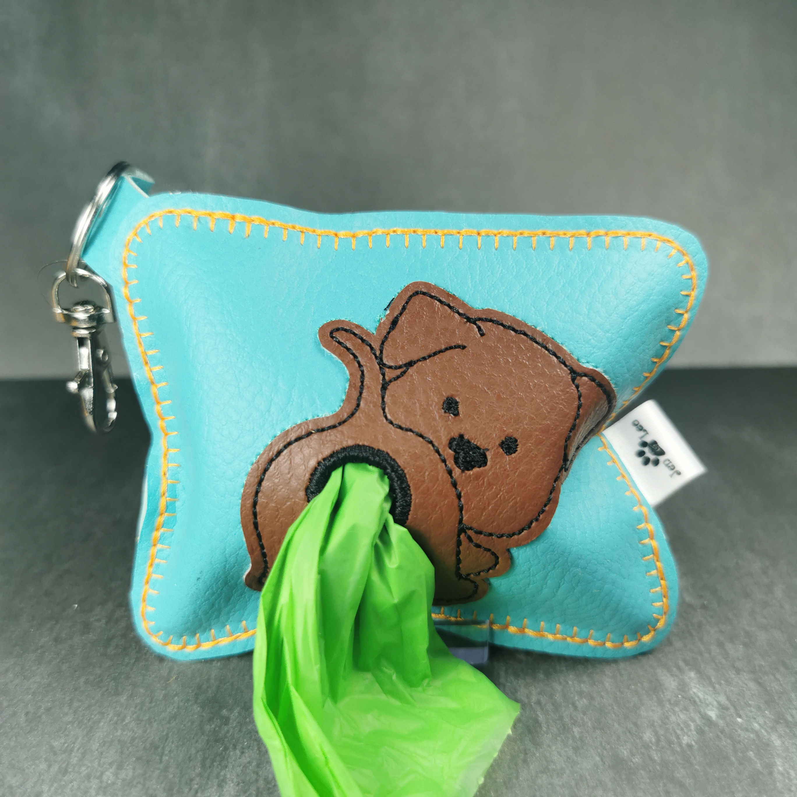 Pochette distributrice de sacs à excréments