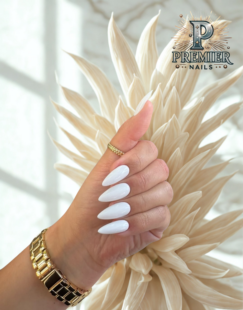Long white acrylic nails with glossy finish at Premier Nails – luxury nail salon downtown Chicago offering acrylic nails, manicures, and elegant nail designs.