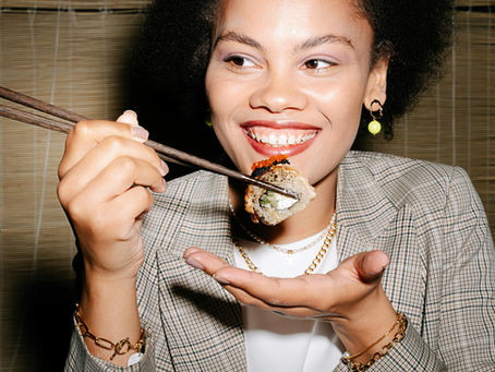 Woman enjoying a sushi roll