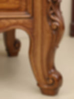 Ornate carved wooden furniture leg