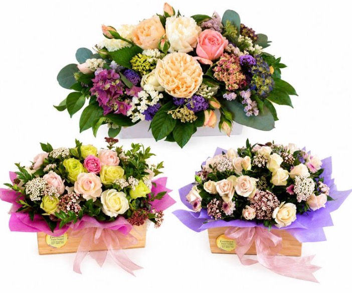 Treasure-assorted pastel roses and foliage in a bamboo wood box with water
