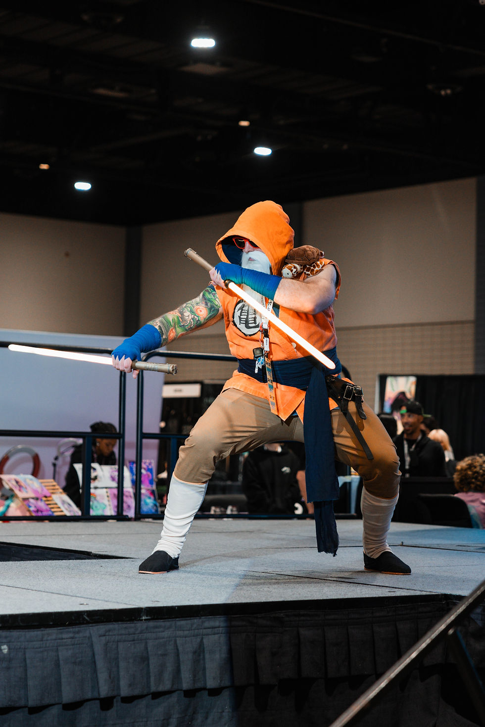 Person cosplaying or dressed up as a mix of the character, Master Roshi, from Dragonball, and a jedi from star wars. The character is called Jedi Master Roshi.