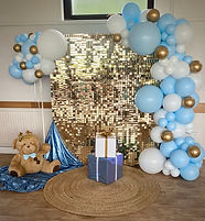 blue gold and white balloon arch