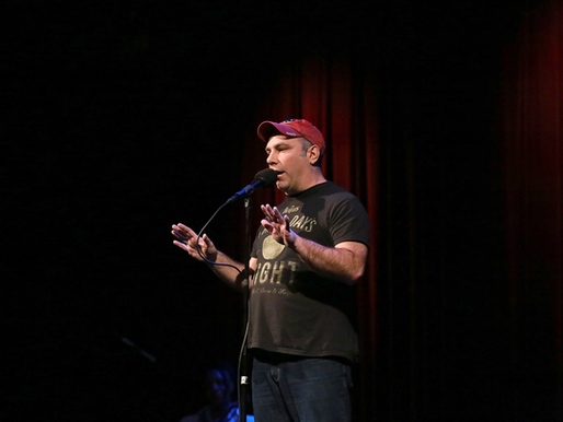 Matthew Dicks on stage at a Moth Storyslam.
