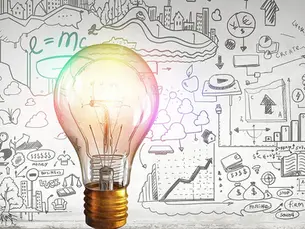 colorful light bulb with illustrations in the background