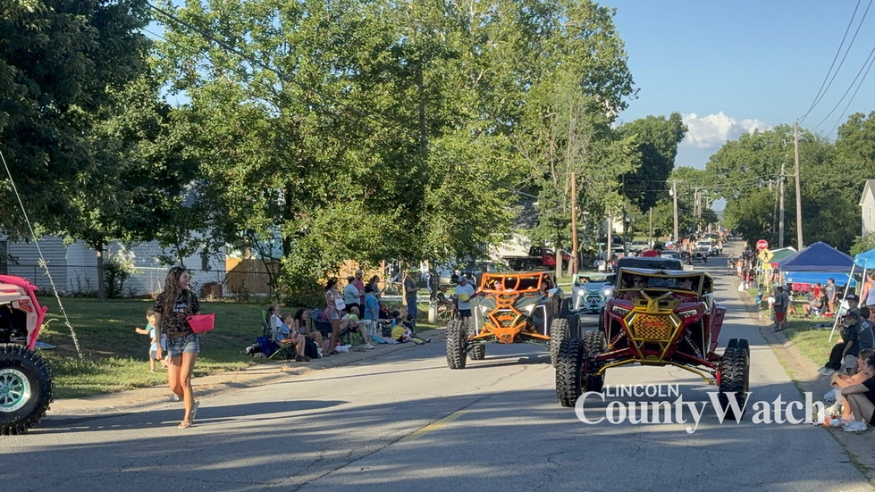 Families, first responders, local businesses, youth organizations, horses, tractors and decorated entries participate in the 2026 Lincoln County Fair Parade in Troy, Missouri.