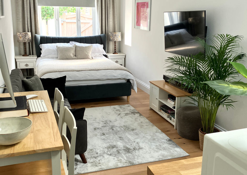 Open plan airbnb with high vaulted ceilings