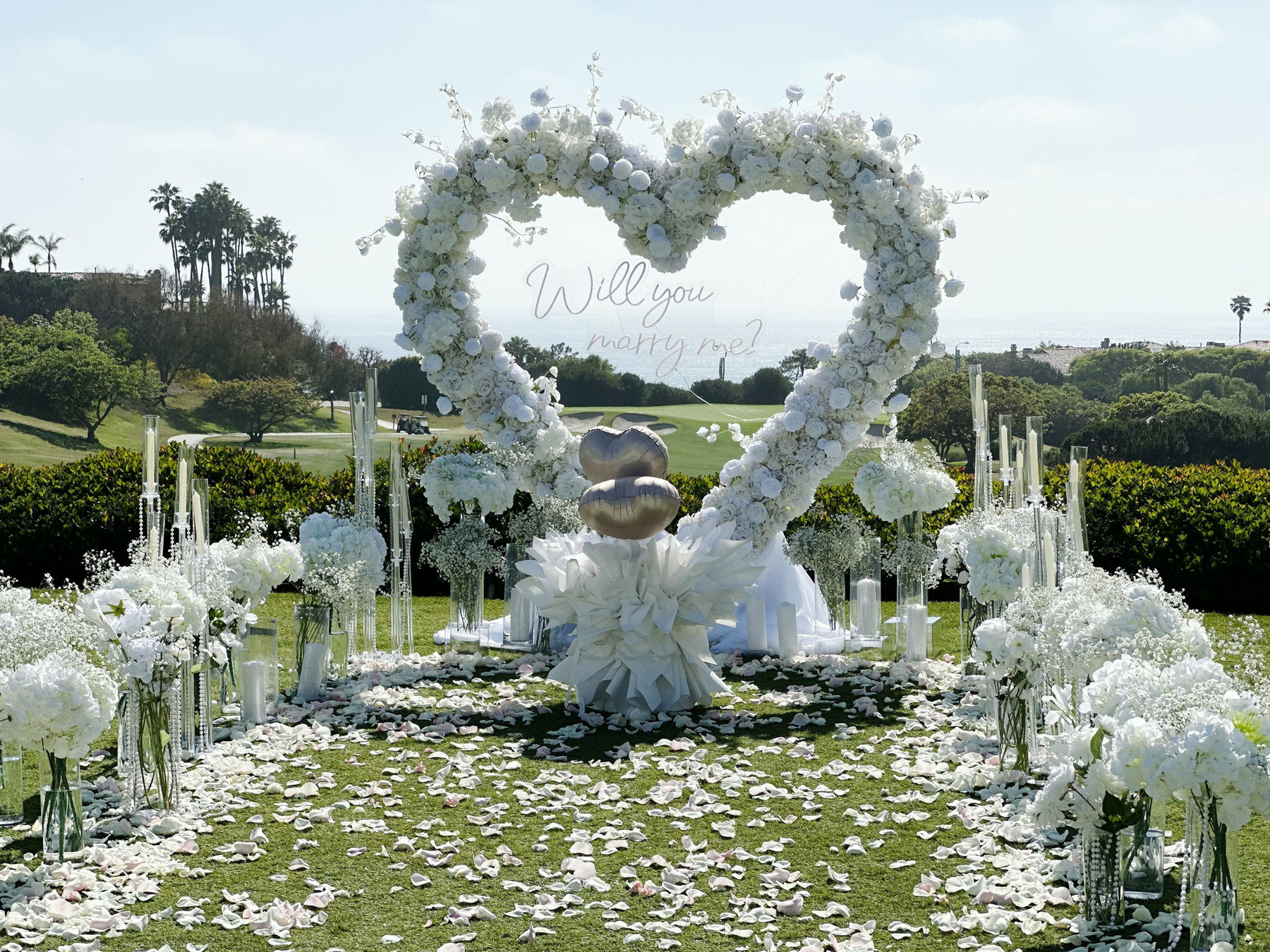 A romantic white floral heart outdoors