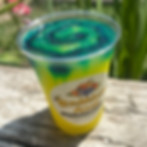 Frozen yellow drink with green and blue swirl