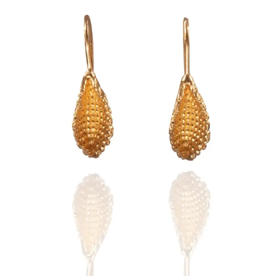 Back view of handmade gold leaf earrings in gold-plated brass, revealing smooth organic contour and artisan craftsmanship.