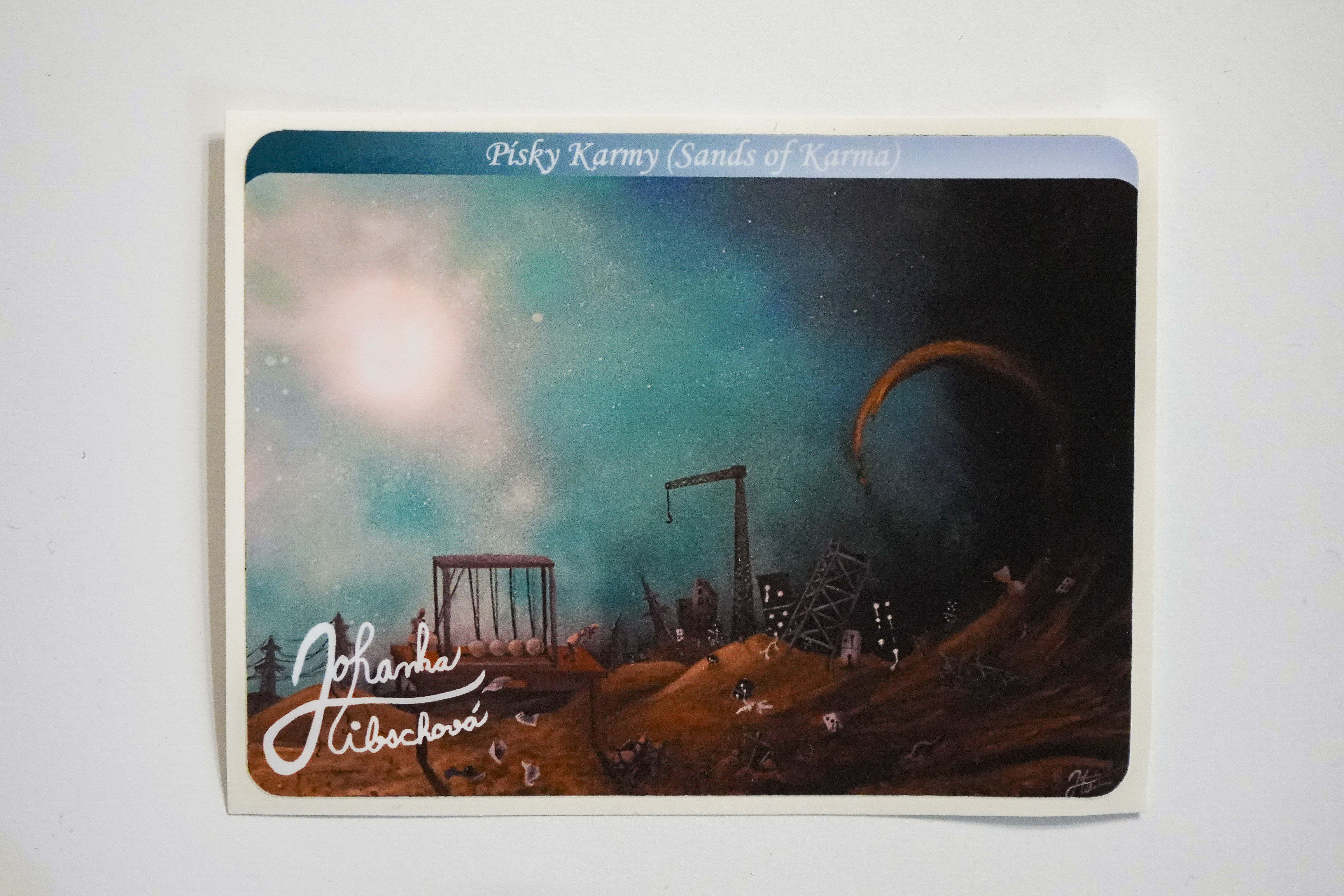 Písky Karmy-Samolepka